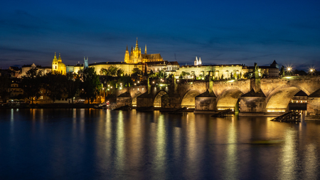 Prague castle with Charles Bridge in the eveningの写真素材