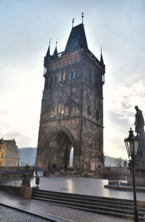 Prague, Czech Republic-17 of March 2020: Entrance gate to Charles Bridgeのeditorial素材