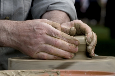 Hands of potter at workの写真素材