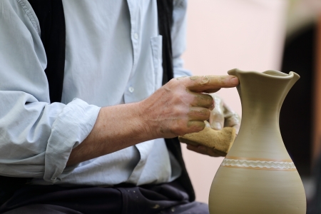 Close up of potter of potter s hands at workの写真素材