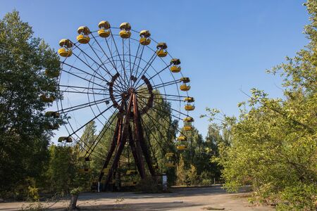 Pripyat abadoned wheel on square inside ghost townの写真素材