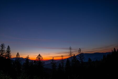 Sunset with stars in the sky and a gradual milky way view of Lysa Hora Czech Republic.
