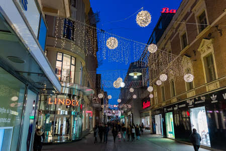 BRNO, CZECH REPUBLIC - NOVEMBER 30, 2018:Moravske namesti (square) during Christmas for event for set up the Christmas tree on square huge crowd people and public transport in background Christmas decoration on surrounding buildings...のeditorial素材