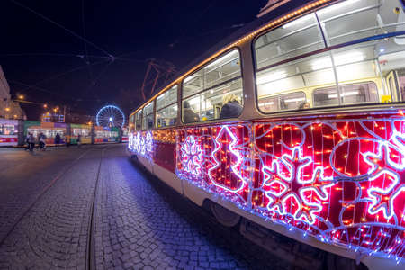 BRNO, CZECH REPUBLIC - DECEMBER 8, 2019: Christmas special tram illuminated by light with Christmas motif in Brno on traditional Moravian markets.のeditorial素材