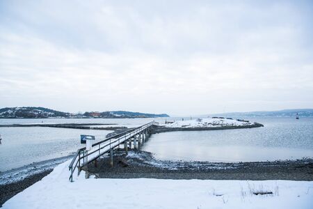 Overlooking landscape of the islands around Oslo Norway over the winter overlooking the sea and the Fjord during dayの写真素材