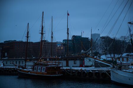 Port in Oslo Norway during sunset in winter view View of the sea and anchored boats.の写真素材