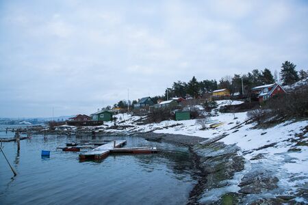 Oslo Norway coast during winter with a large number of docked boats in the center of the city...