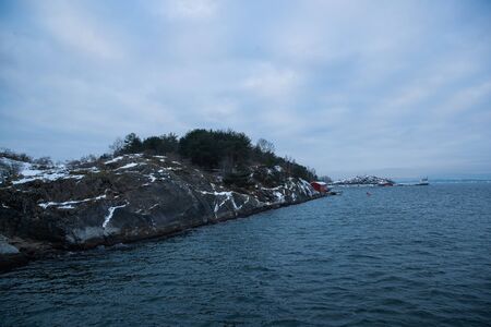 Overlooking the coast of the islands around Oslo Norway over the winter overlooking the sea and the Fjordの写真素材