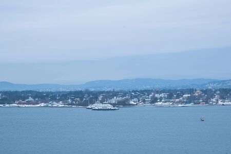 Oslo Norway coast during winter with a large number of docked boats in the center of the city...