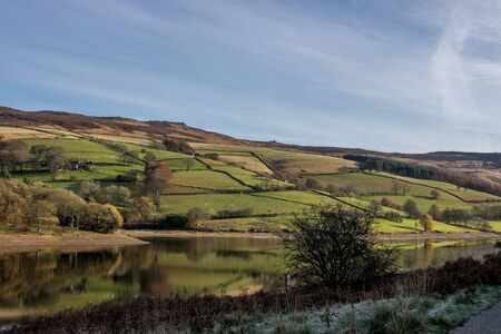 Landscape in Uk land with river and fields around hillの写真素材