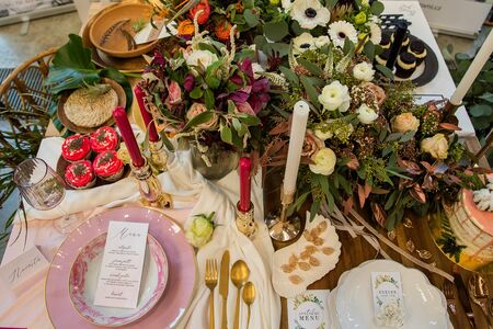 Wedding decoration on the table during the event before the wedding where the bride and groom flowers will be handmade food cakes cupcake decoration bowls and everything for the wedding dayの写真素材