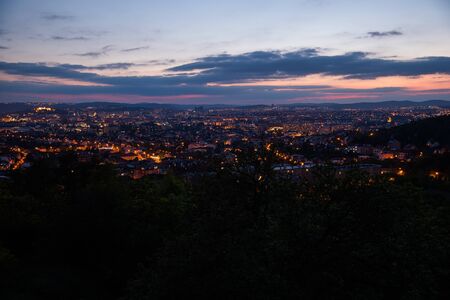 Colorful sunset on Bila Hora with beautiful view on city Brno, Czech Republic pink and orange colors...