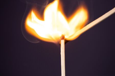 Close up Macro shot of a ignition match on a second match captured in super slow motionの写真素材