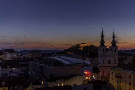 The center of the city of Brno in the Czech Republic during a dramatic sunset captured from a beautiful view on the Old Tower on the way to the Square of Freedomの写真素材