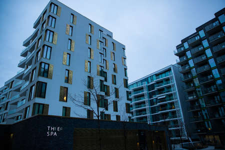 Modern architecture of the city of Oslo Norway during the winter with Christmas decoration in the snow-covered center.のeditorial素材