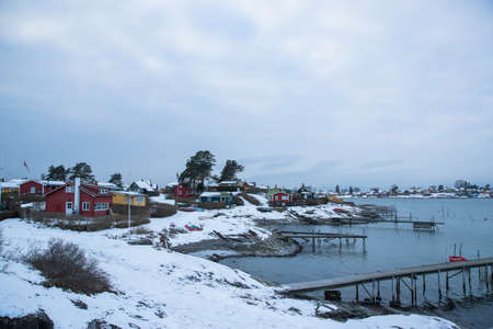 Traditional cottages on the islands around Oslo Norway during the winter overlooking the sea and the Fjord in snow conditionのeditorial素材