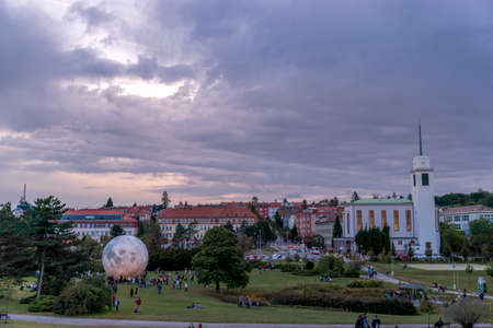 Event City Observatory Brno Kravi Hora timelapse of people moving with Lunalon artificial moon during the evening with the transition into the night when the moon and the city light up.のeditorial素材