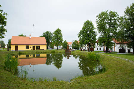 Holasovice, a small lake in the middle of a small baroque village, Unesco heritage, South Bohemia, Czech Republicのeditorial素材