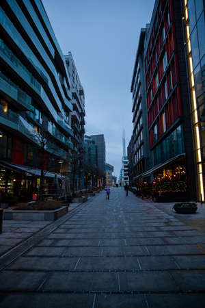 Modern architecture of the city of Oslo Norway during the winter with Christmas decoration in the snow-covered center.のeditorial素材