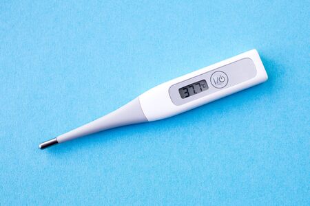 detail of digital thermometer with 37,7 ? C of fever, flu, covid19, virus,