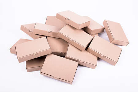 Stack of boxes of the same size isolated on white backgroundの写真素材