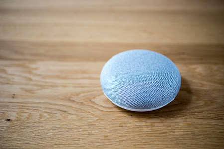 Smart speaker on table desk, voice controlled, device, smart home assistant, music streamingの写真素材