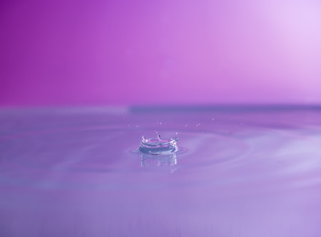 Water falling into waterの写真素材