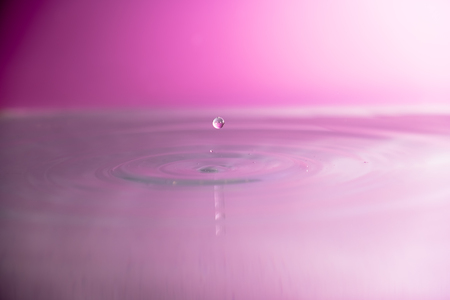 Water falling into waterの写真素材