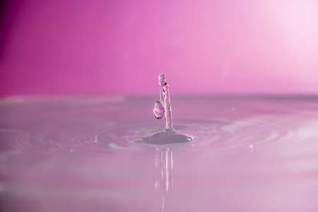 Water falling into waterの写真素材