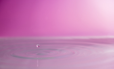 Water falling into waterの写真素材