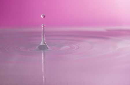 Water falling into waterの写真素材