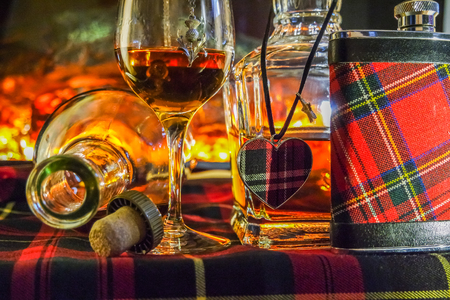 Whisky with open fire in backgroundの写真素材