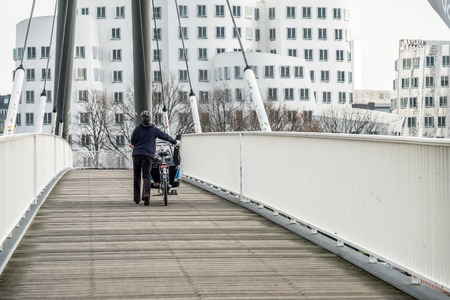 Lady pushing her bikeの写真素材