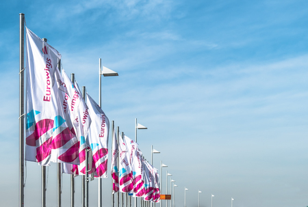 COLOGNE / GERMANY - MARCH 15 2017: Eurowings flags at Cologne Bonn Airport terminal during the...