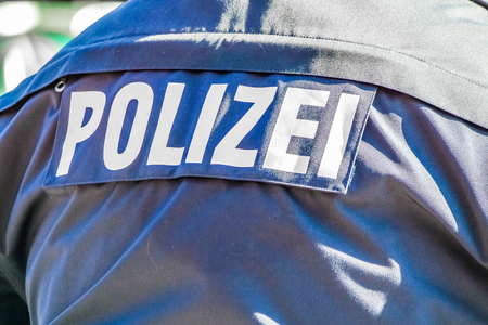 German police man with the blue jacket and police lettersの写真素材