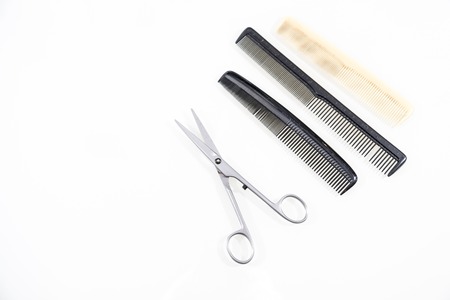 Hair cutting shears and comb isolated on white backgroundの写真素材