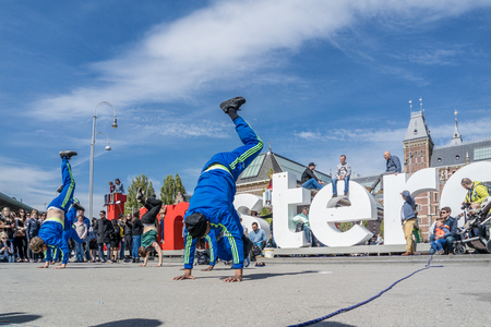 AMSTERDAM/NETHERLANDS - APRIL 31, 2017 - The Ajax Amsterdam breakdancing group performing in the cityのeditorial素材