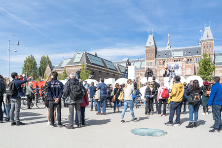 Amsterdam / Netherlands - April 31, 2017 : People walking around the I Amsterdam letters in the square in front of the museum, time lapseのeditorial素材