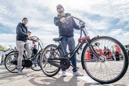 Amsterdam / Netherlands - April 31, 2017 : Tourist enjoy driving their bicycles in the streets of Amsterdamのeditorial素材