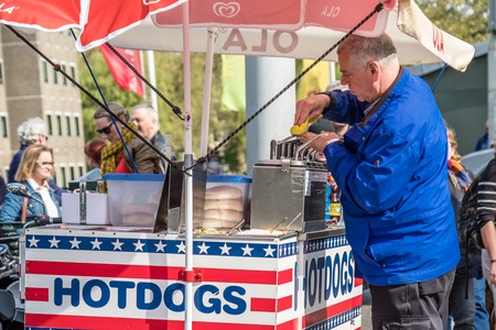 Amsterdam / Netherlands - April 31, 2017 : Man selling hotdogs in the streetのeditorial素材