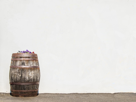 Whisky cask in front of wall
