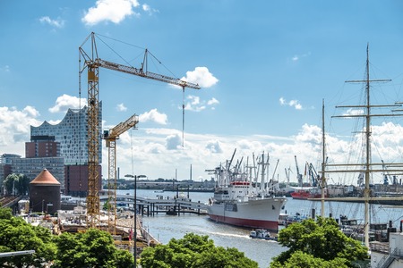 Hamburg / Germany - July 14, 2017: Cranes are working at the construction site between the St. Pauli Piers and Baumwallのeditorial素材