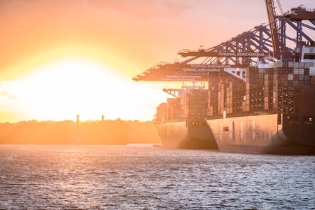 Hamburg / Germany - July 12 2017: Container gantry cranes of the terminal Eurogate and Burchardkai getting ready for unloading ships in the deepwater port Hamburg-Waltershofのeditorial素材