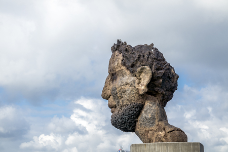 Duisburg / Germany - October 03 2017 : The sculpture Echo of the Poseidon created by Markus Lueppertz is greeting mariners on the mercator islandのeditorial素材