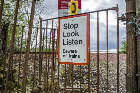Loch Awe, Argyll / Scotland - May 15 2017 : Sign with instructions how to tresspass the railwayのeditorial素材