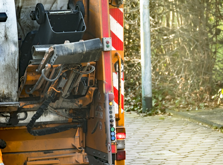Garbage man collecting the bins