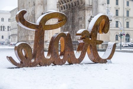 Munich / Germany - February 17 2018 : At the Victory Gate is standing a sculpture showing the letter love and from the back hate, build by the artist Mia Florentine Weissのeditorial素材