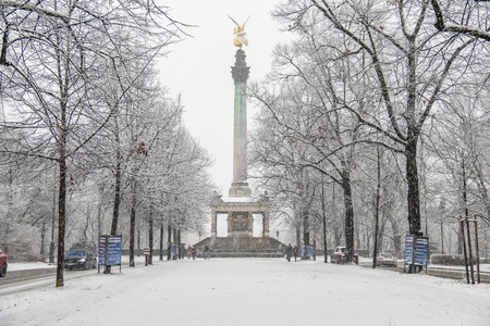 Munich / Germany - February 17 2018 : The Angel of Peace on the top of Friedensengel monument in Munich, Germany during the snow srormのeditorial素材