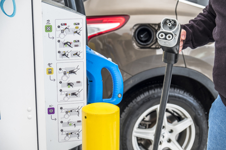 Limburg , Germany - February 11 2018 : Man charging his electric carのeditorial素材
