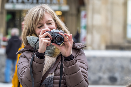 Munich / Germany - February 15 2018 : Lady photographing her familyのeditorial素材